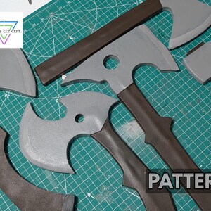 May include: A collection of four gray and brown foam axe props with varying blade shapes and handle designs. The items feature a gray head and a brown handle. A logo with the text CHRIS CONCEPT and the word PATTERN are visible on the surface.