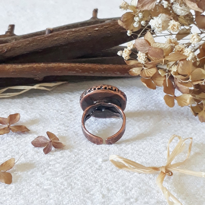 Ring made of Brass with real flowers and resin baby/'s breath, wild carrot and leaves.