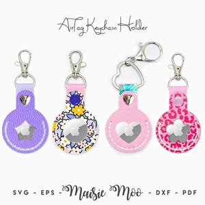 May include: Four AirTag keychain holders with silver metal clasps. The first is purple with a star cutout, the second has a floral pattern, the third is pink with a heart cutout, and the fourth is pink leopard print with a flower cutout. Text reads AirTag Keychain Holder and Maisie Moo.