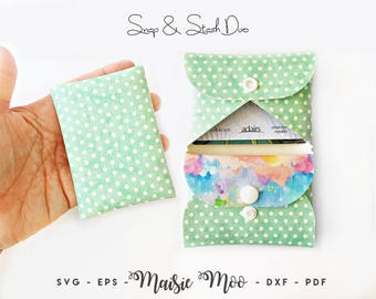 May include: A light green pouch with a white polka dot pattern and a white snap closure. The pouch is shown closed and open, revealing a colorful watercolor-style interior lining. The text "Snap & Stash Duo" and "Maisie Moo - SVG - EPS - DXF - PDF" appear.