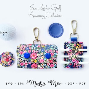 May include: A faux leather golf accessory collection featuring a floral print pouch with blue snap buttons, a matching floral print tee holder with three white golf tees, a floral print circular marker, a blue circular marker, and a white Srixon golf ball.