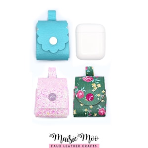 May include: Three protective cases for wireless earbuds and one white charging case. One case is textured turquoise with a scalloped flap, one is light pink glitter, and one is dark green with a floral pattern. Each has a snap button closure.