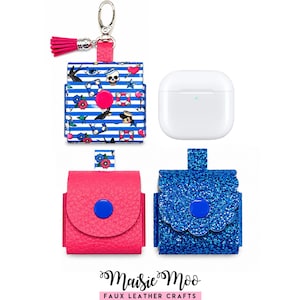 May include: Three protective cases for wireless earbuds and a white charging case. One case features a blue and white striped pattern with nautical icons, a pink snap, and a pink tassel keychain. One is solid pink with a blue snap, and one is blue glitter.