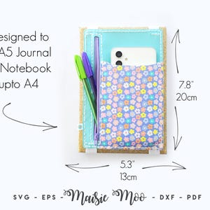 May include: A teal journal cover with a floral pocket, holding a phone and pens. The cover is 20cm tall and 13cm wide. Text reads "Designed to fit A5 Journal or Notebook upto A4".