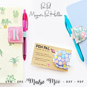 May include: A collection of magnetic pen holders in various designs. One pink holder features the letter "R" on a pink background. Another has a floral pattern. The image includes notebooks and pens, with the text "Pen Pal Magnetic Pen Holder."