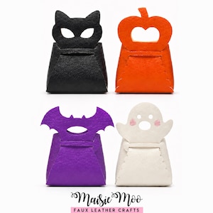May include: Four small felt treat bags featuring Halloween-themed cutouts: a black cat, an orange pumpkin, a purple bat, and a white ghost with pink cheeks. The text Maisie Moo Faux Leather Crafts is printed at the bottom of the image.