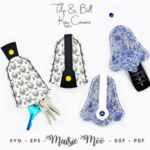 May include: Four Tulip & Bell key covers with a white background. Two covers feature a black and white French bulldog pattern with yellow snaps. Two covers feature a blue and white floral pattern with blue snaps. One cover holds metal keys.
