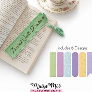 May include: A light green faux leather bookmark with the text "Dearest Gentle Reader" and a green tassel, placed in an open book. The image also shows six additional bookmark designs in various pastel colors.