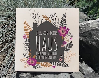 May include: A white card with a black house silhouette and floral accents. The text reads "HERR, SEGNE DIESES HAUS UND ALLE, DIE HIER GEHEN EIN UND AUS."