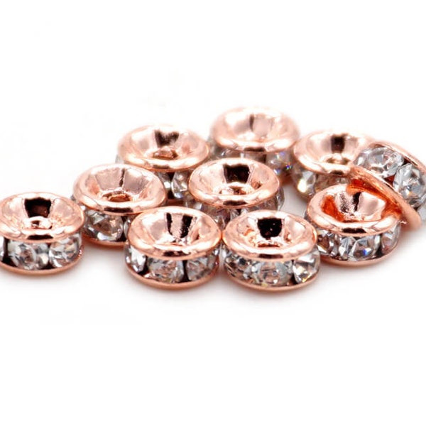 0.31 EUR/pc. Spacer beads with rhinestones in peachy rose gold color 4 mm 10 pieces