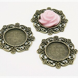 0,80 EUR/pz. 3 telai per cabochon da 14 mm in bronzo antico