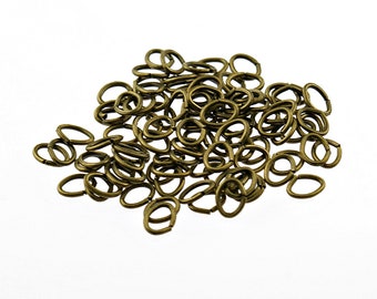 0,02 EUR/Stk. 100 längliche Biegeringe in antik Bronze, 5 x 4 mm