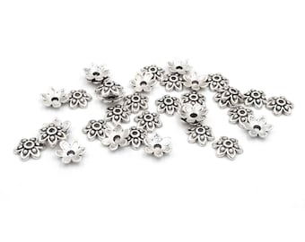 0,10 EUR/stuk. Kralenkapjes in bloemvorm in antiek zilverkleur 9 mm 30 stuks