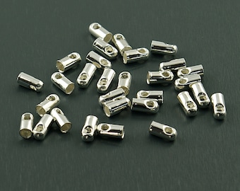 0,08 EUR/pz. 30 tappi terminali in argento per nastri da 2 mm