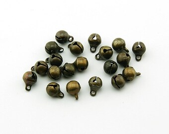 0.08 EUR/pc. 30 small brass bells in antique bronze