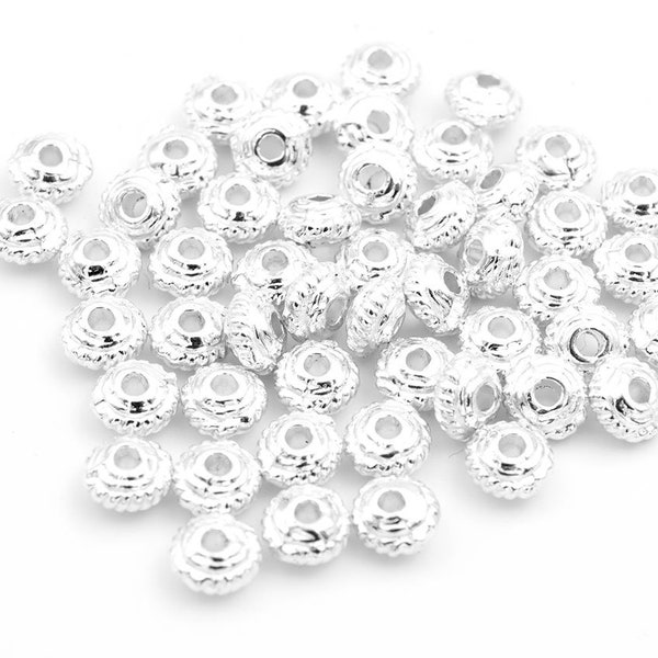 0,05 EUR/ud. cuentas espaciadoras decoradas en color plata 5 mm 50 piezas