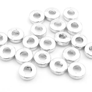0.11 EUR/piece flat spacer beads in silver-colored 6 mm 20 pieces