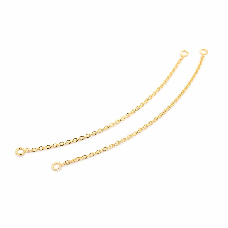 May include: Two gold chain extenders with jump rings at each end.