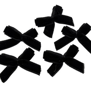 0,25 EUR/pièce. 10 nœuds en velours noir, 27 mm