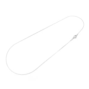 May include: A delicate silver-colored necklace with a fine chain. The necklace features a simple, elegant design with a small clasp at the end. The chain is thin and appears to be made of a shiny metal.