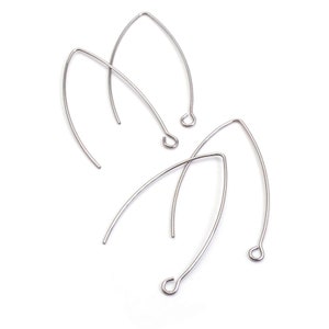 May include: Three silver-toned earring hooks with a pointed end and a loop at the other end.
