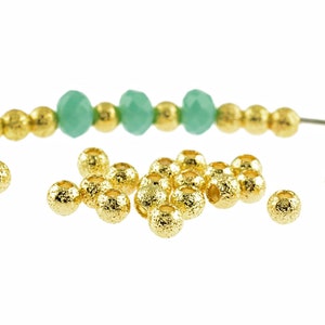 0.08 EUR/piece 30 spacer beads &quot;Sparkle&quot; in gold, 3 mm