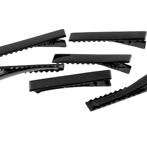 0.23 EUR/piece 10 hair clips in black lacquer, 45 mm