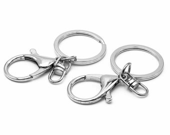 1.40 EUR/piece Vintageparts DIY sturdy snap hooks with key ring with suspension in platinum colour 2 pieces