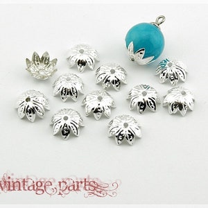 0.05 EUR/piece 50 bead caps in silver, 10 mm diameter