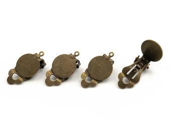 0,72 EUR/pz. Clip per orecchie con cuscinetto adesivo da 12 mm e sospensione in colore bronzo antico, 4 pezzi