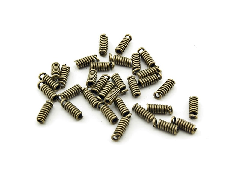 0.05 EURpc 1.5 mm 40 end caps for ribbons in antique bronze