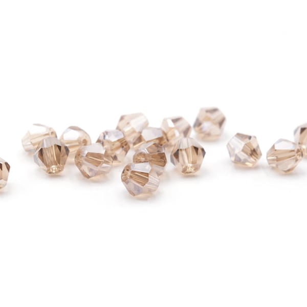 0,07 EUR/pièce. Vintageparts DIY perles de verre coupées en toupies en beige 6 mm 40 pièces