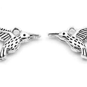0.29 EUR/piece. Pendant as hummingbird in antique silver, 8 pieces.