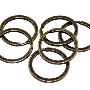 0.15 EUR / 1 piece 10 small key rings in antique bronze