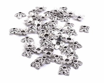 0,05 EUR/st. 50 kleine blaadjes parelkapjes in antiek platina kleur 7 mm