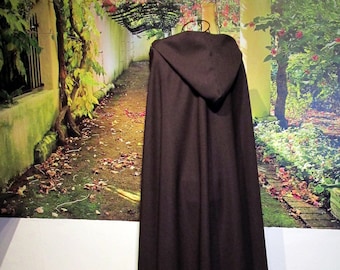 May include: A brown hooded cloak with a long, flowing design. The cloak is made of a soft, comfortable fabric and has a simple, elegant style.