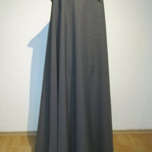 May include: A long, gray hooded cloak with a simple design. The cloak is made of a soft, flowing fabric and has a drawstring closure at the neck.