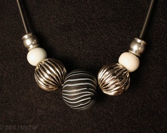 Glass bead necklace zebra stripes handmade glass beads on rubber cord black white stripe pattern glass bead jewelry sterling silver