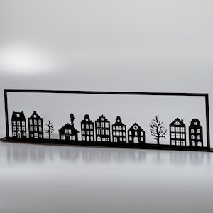 Row of houses for the windowsill or for the window to hang canal houses Nordic