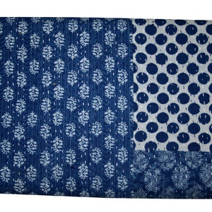 May include: A blue and white kantha quilt with a variety of patterns, including polka dots, leaves, and paisley designs.