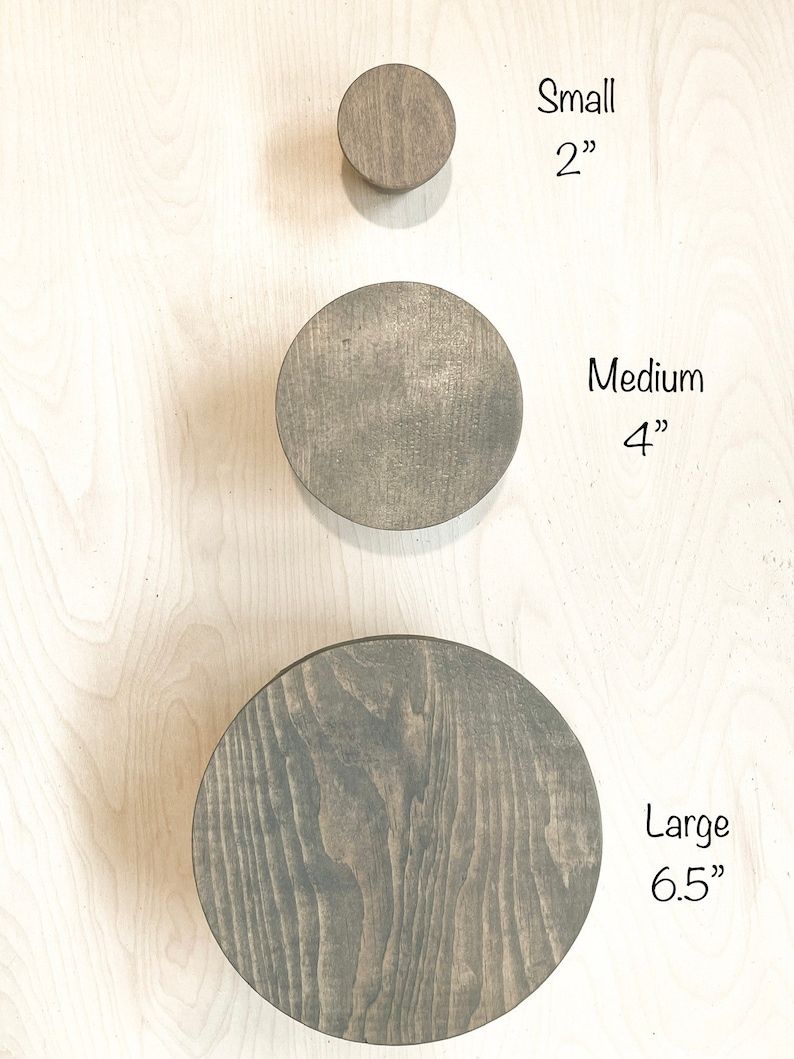 May include: Three wooden wall hooks in different sizes: small (2 inches), medium (4 inches), and large (6.5 inches).