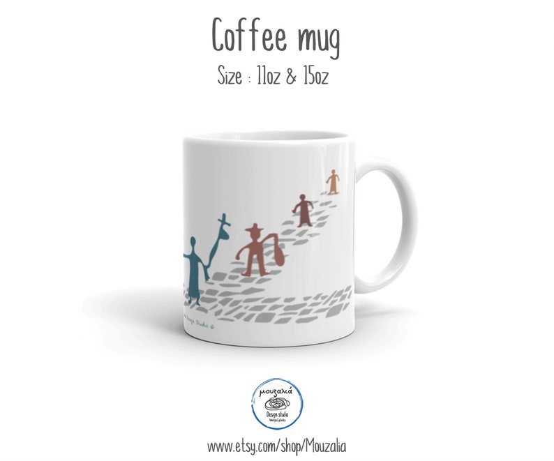 May include: A white ceramic coffee mug featuring a graphic of four stylized figures walking along a gray cobblestone path. The text Coffee mug and Size: 11oz & 15oz appear above the mug. The figures are colored in blue, brown, and tan.