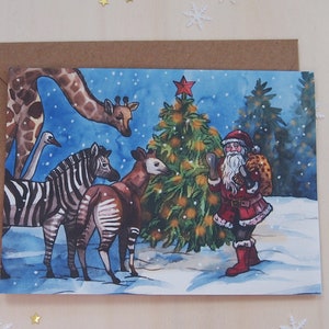 Biglietto di auguri di Natale allo zoo con giraffa, okapi, zebra e struzzo
