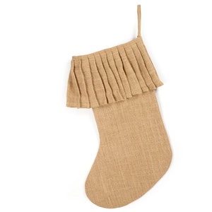 May include: A brown burlap Christmas stocking with a ruffled top.
