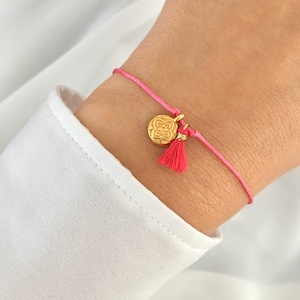 Macrame summer bracelet in pink with a sweet tassel and a mandala