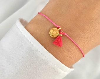 Macrame summer bracelet in pink with a sweet tassel and a mandala