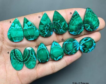 May include: A collection of ten polished malachite gemstones in teardrop and circular shapes, featuring vibrant green banded patterns. The stones are numbered 1 through 6, with a size range of 26-19mm printed in the bottom right corner.