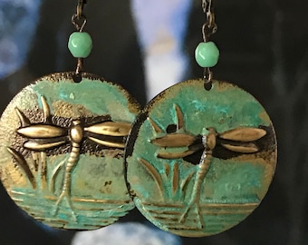 Lovely Dragonflies, Turquoise Patina, Brass Stamping.  A unique and light 1 1/8” Disc Earring - Cat Tails arise out of the pond background.