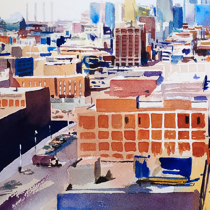 May include: A watercolor painting of a city skyline with buildings in shades of brown, orange, and blue. The buildings are arranged in a grid pattern, with some buildings taller than others. The painting is done in a loose, impressionistic style.