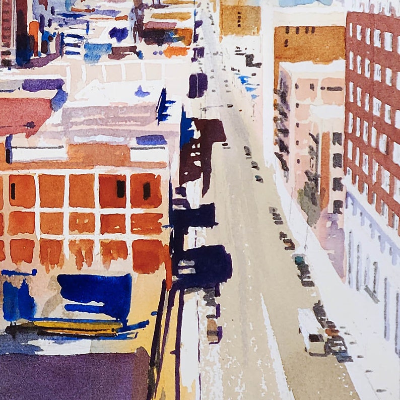 May include: A watercolor painting of a city street scene from a high angle. The street is lined with buildings on both sides, and there are cars parked on the street. The buildings are painted in shades of brown, orange, and red, and the street is painted in shades of gray and white.